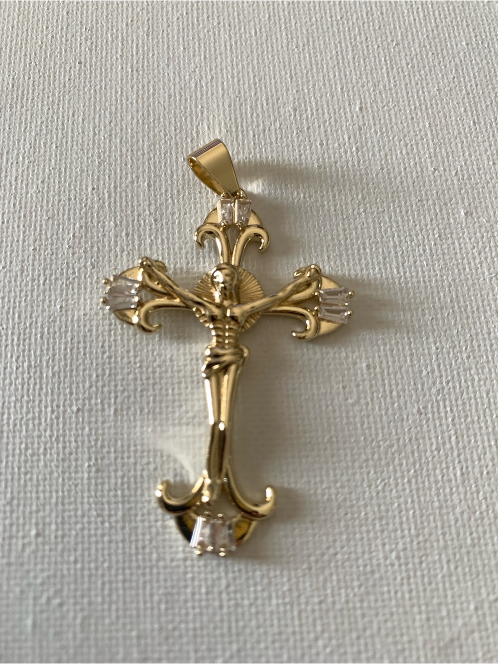 Gold Tone Fleur-de-Lis Crucifix Pendant with Clear Accents